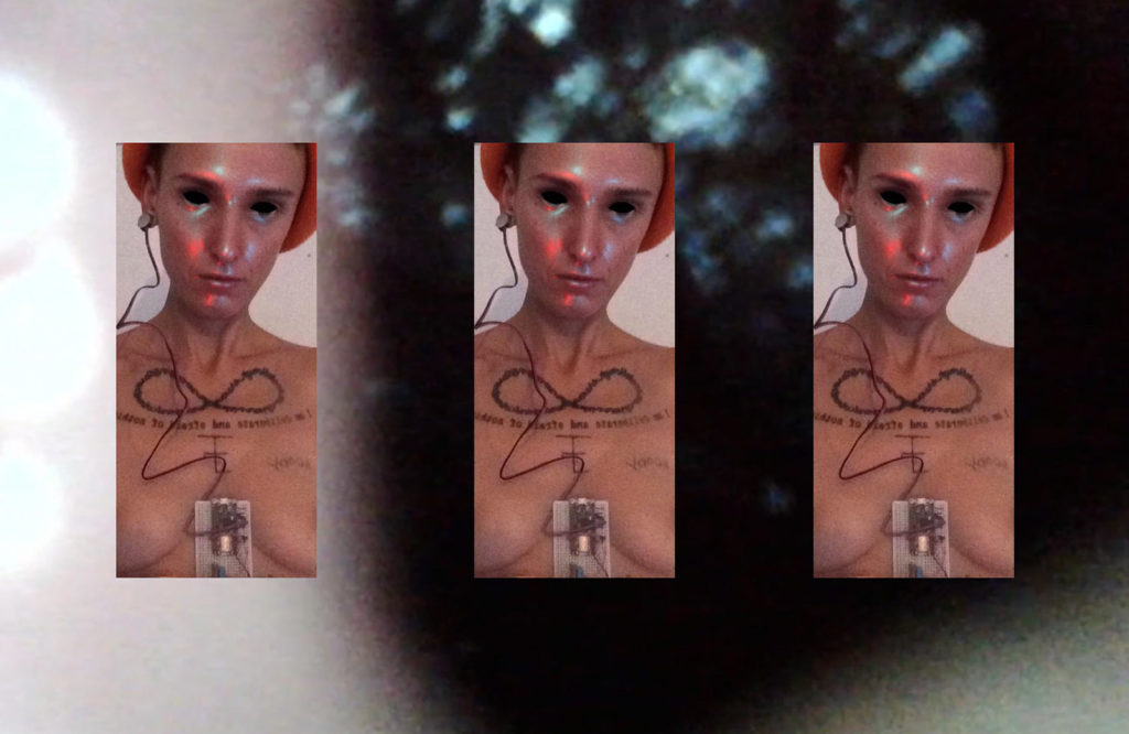 Trio of low quality self portraits of the artist with black contact lenses wearing an orange hat. A piece of computer software strapped to their chest. The background is blurry; a close up still of the inside of their body captured using a drain camera.